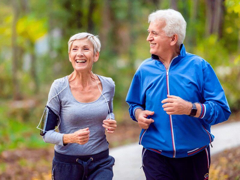 An older couple enjoying a pleasant jog