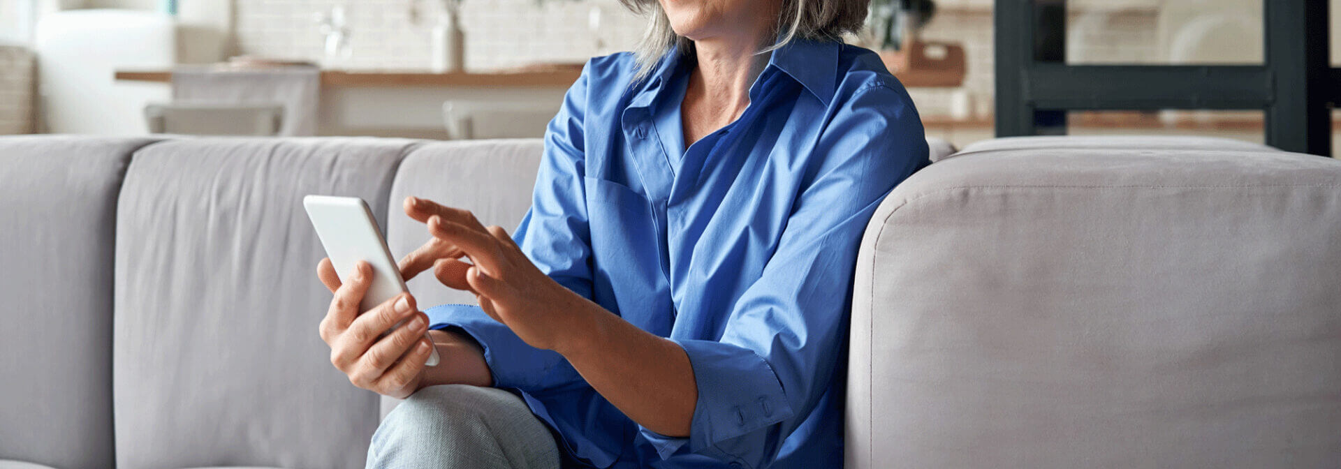 Woman scrolling through her phone looking for a law office