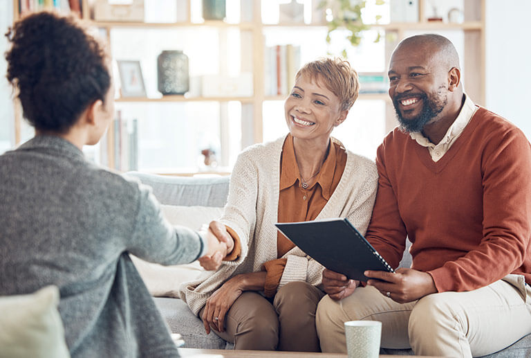 A couple meeting with a lawyer