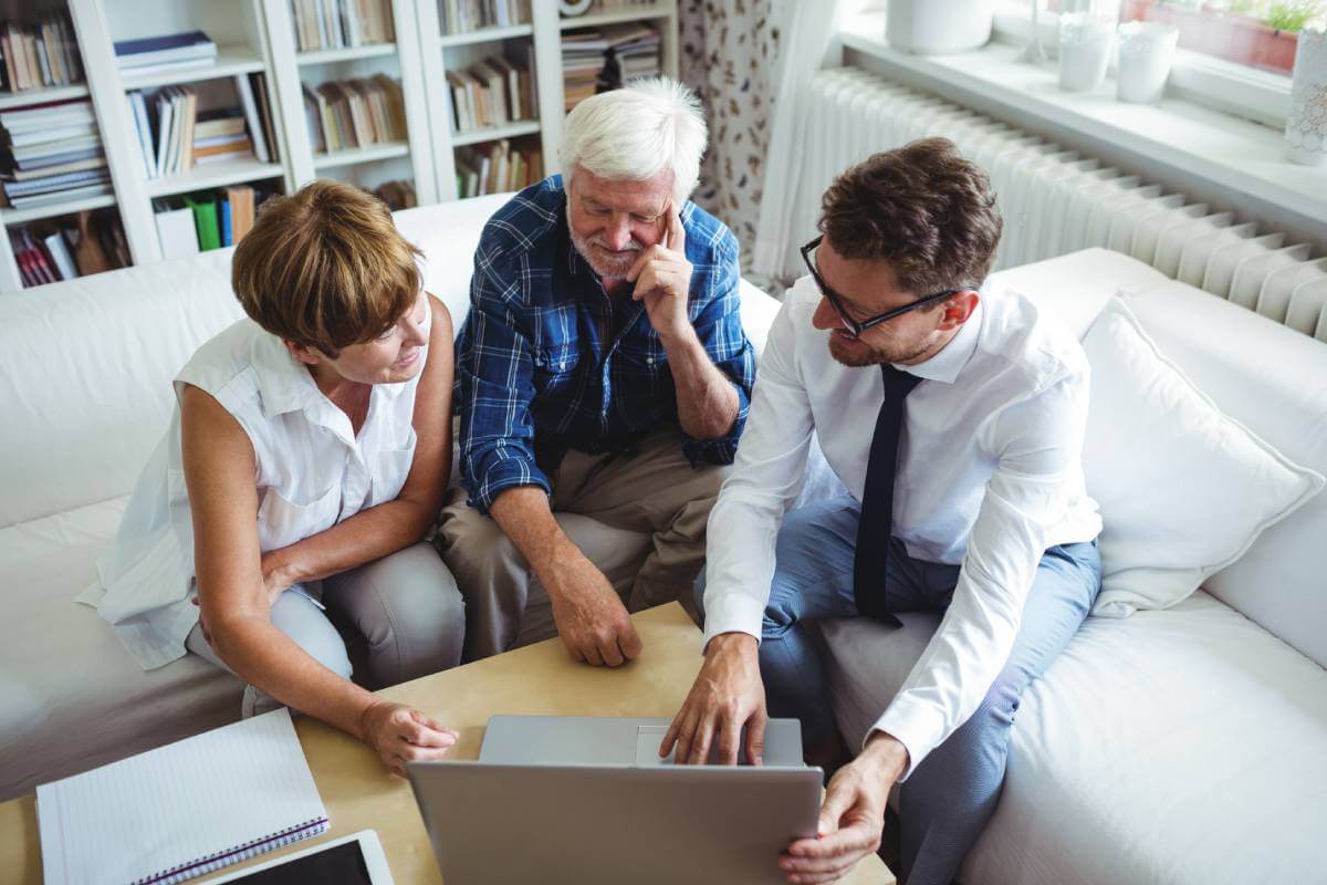 Senior couple discussing estate plan and will with estate planning lawyer