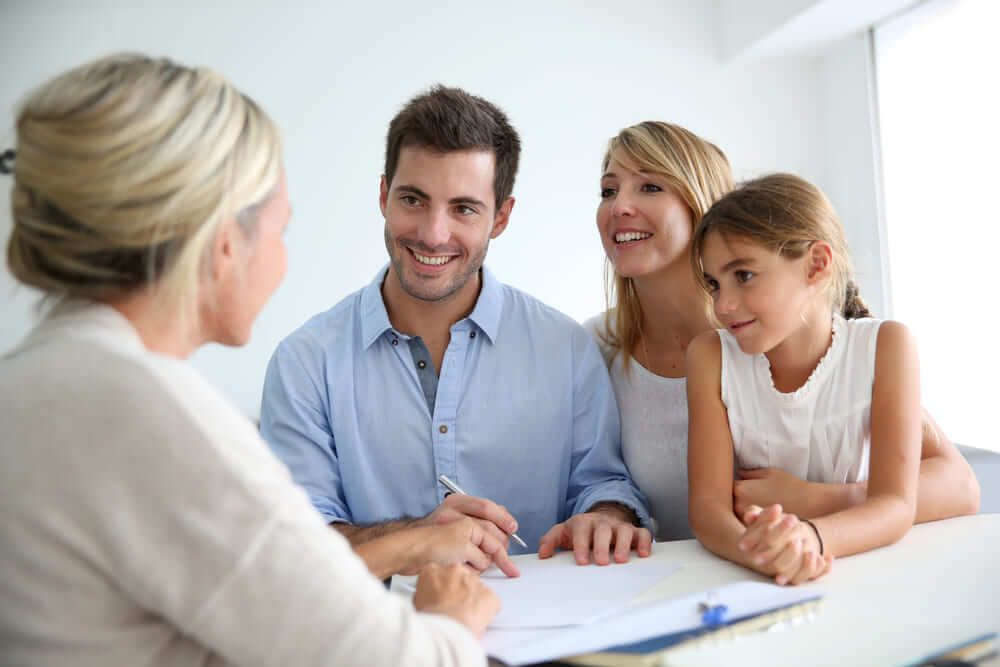 Young Happy Family Meeting Trust Attorney To Discuss Setting Up Family Trusts