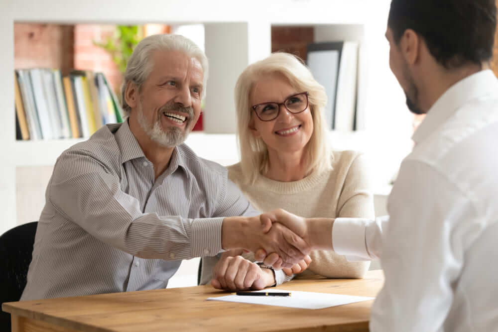 Happy smiling senior couple setting up a trust in California with estate planning attorney