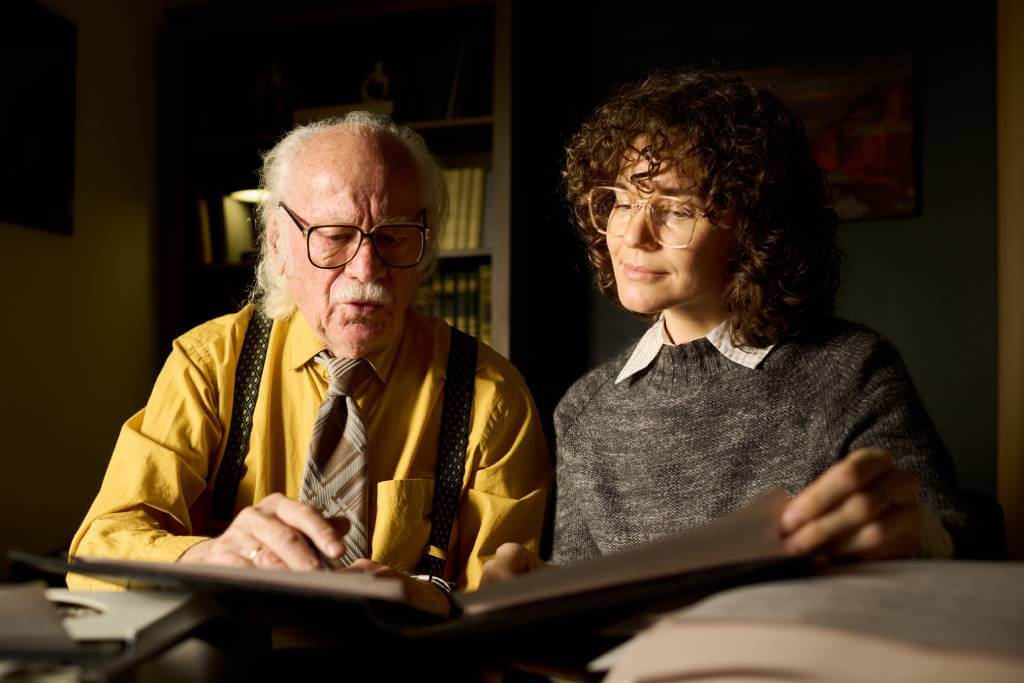 A Daughter Helping Her Father Go Through Legal Documents